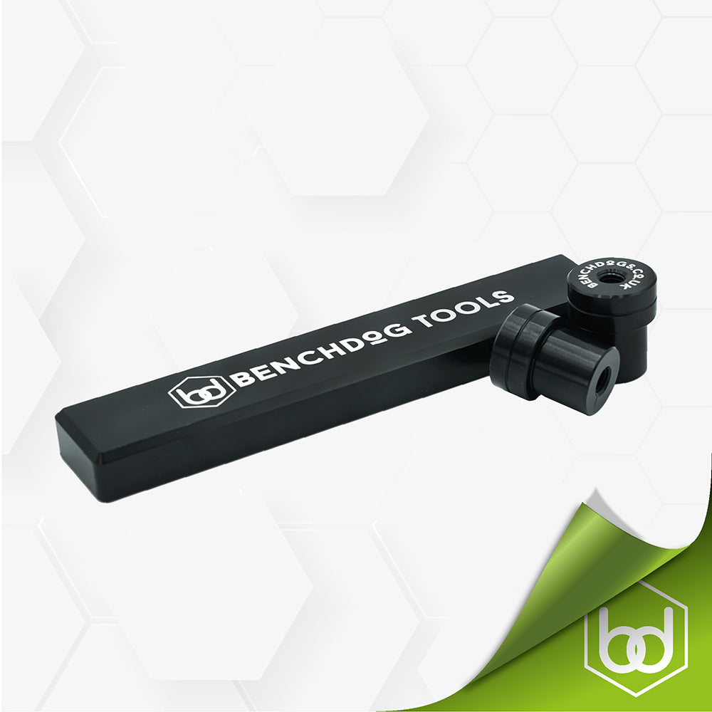 A black aluminum B-Stop tool with the Benchdogs brand logo, designed for woodworking, placed on a white surface.
