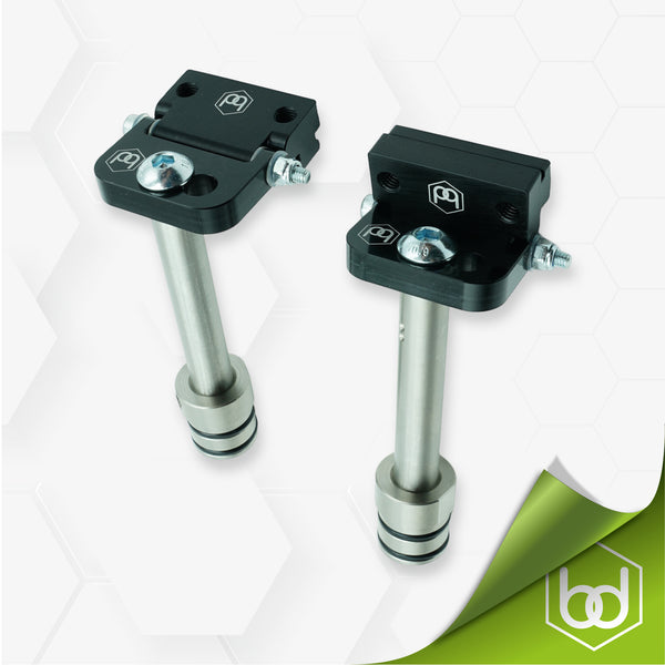 Two Hinge Dogs with silver 95mm Rail Dogs on a white background, featuring the Benchdog Tools logo